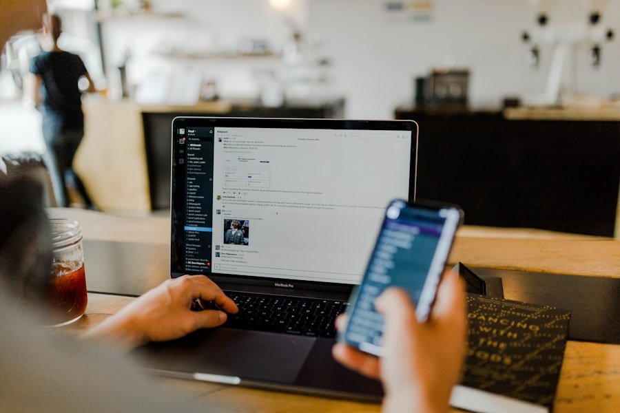 A phone and laptop in use together, illustrating cross-device social browsing